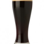 Fresh beer glass over white background